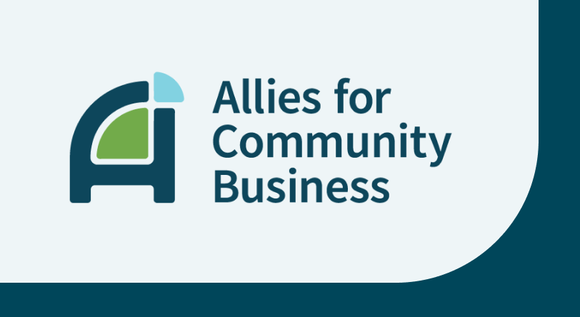 the new logo for Allies for Community Business: a navy blue capital A with a green rounded triangle inside it and a small light blue triangle on the top right corner