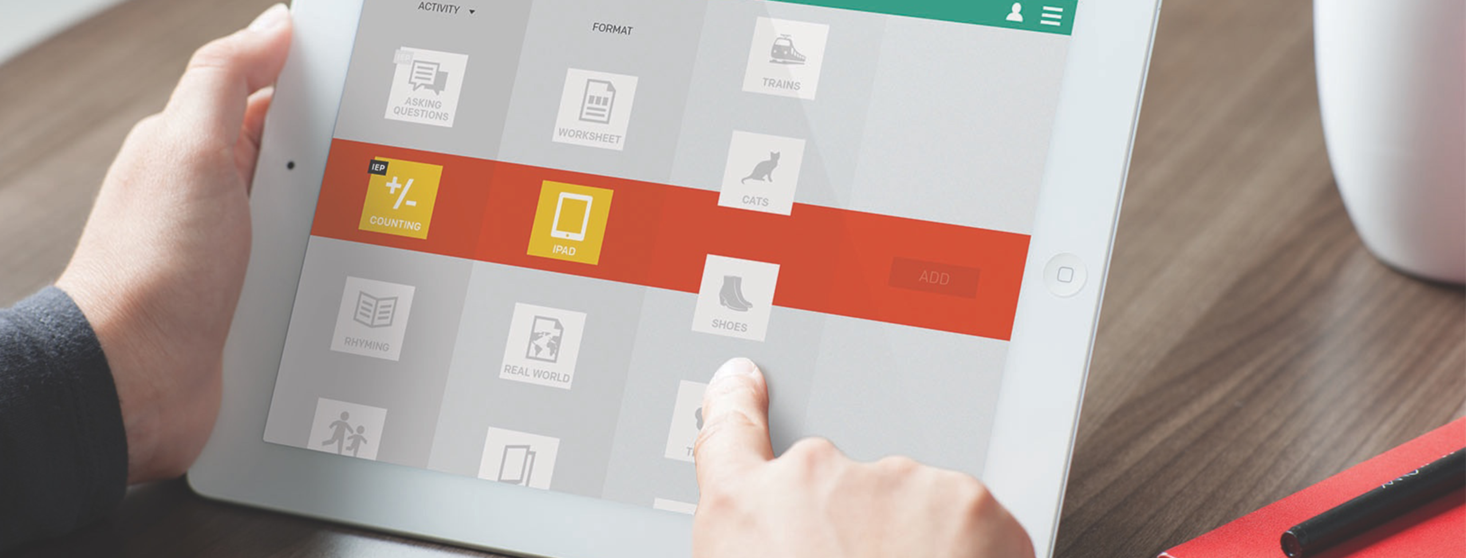 a pair of light-skinned hands holding a white iPad, which displays the interface for an app for children with autism. the hands are scrolling different themes like Trains, Cats, and Shoes.